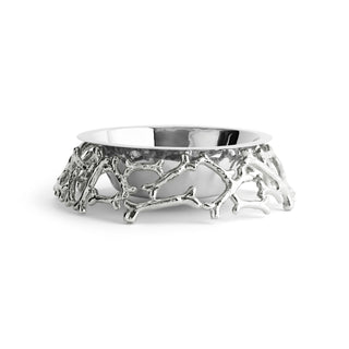Michael Aram dog bone bowl in polished nickel plate, low side view of the ring of sculpted bones beneath the steel bowl. photograph: Courtesy of Michael Aram