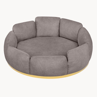 Looty Camelia pet bed, medium, in taupe fabric with a gold-tone base: a round bed of padded petal-shaped cushions. photograph: Looty