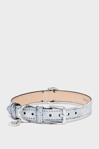 Maison Margiela Bianchetto collar in pale brushed leather, three-quarter view with the buckle, D-ring and engraved round charm. photograph: Courtesy of Maison Margiela